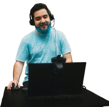 Man using a laptop and webcam setup for remote work or video call