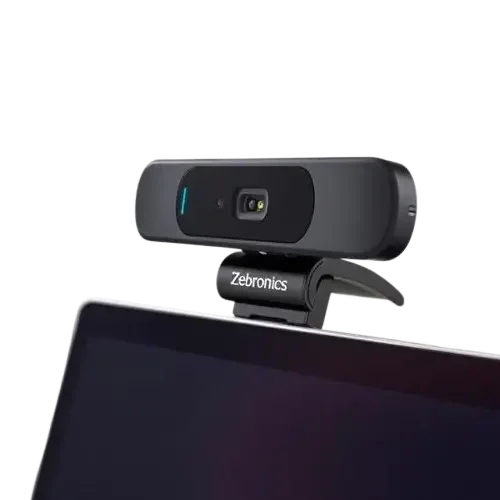 Budget webcams on a wooden desk for work from home setup in India – clip-on, tripod, and square webcam models